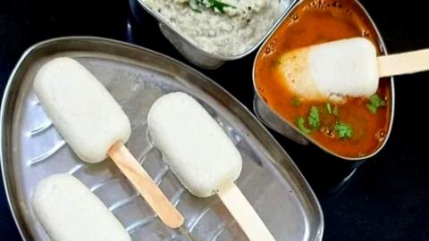 Idli, a steamed rice cake, served on an ice-cream stick