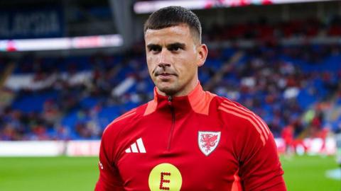 Goalkeeper Karl Darlow warms up before Wales' game against Turkey