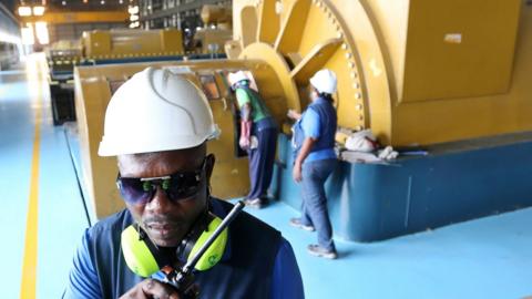 Power plant workers in action at a site in Nigeria.