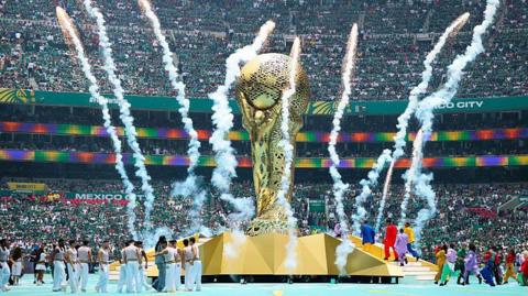 Fireworks going off around a huge replica of the World Cup trophy at the opening ceremony before Mexico v South Africa