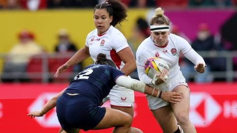 Megan Jones carries the ball for England