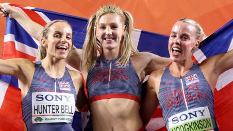 Georgia Hunter Bell, Molly Caudery and Keely Hodgkinson celebrate their world golds together