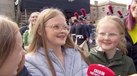Children wait to see King Charles in Hillsborough