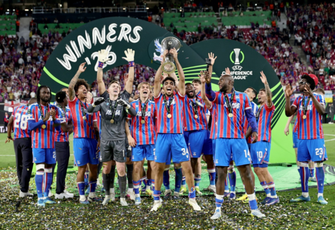 Crystal Palace player Chadi Riad lifts the trophy as the team celebrate winning the UEFA Conference League final match 