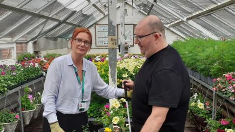 Garden Linx supervisor Susan Atkinson and Shaun Liddle in the nursery