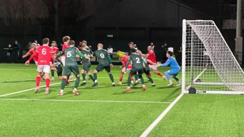 Action from Jersey Bulls v Ashford United