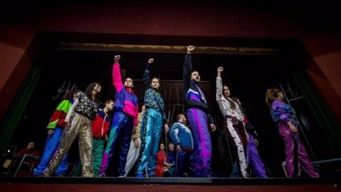 Actors perform on stage during a rehearsal of the play "Slobodan Show" in a theatre in Belgrade