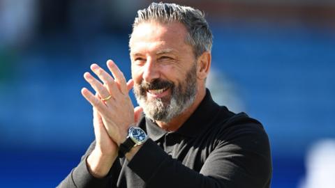 Derek McInnes claps his hands
