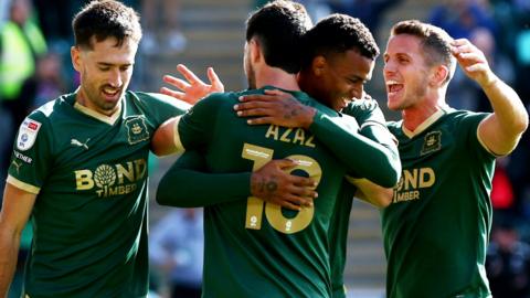 Plymouth Argyle players celebrate a goal