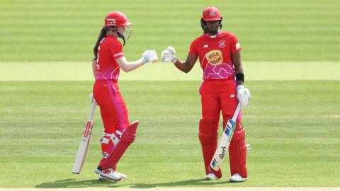 Sarah Bryce and Hayley Matthews of Welsh Fire fist pump during The Hundred