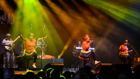 The Mahotella Queens perform on stage