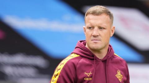 Huddersfield Giants head coach Luke Robinson looks on