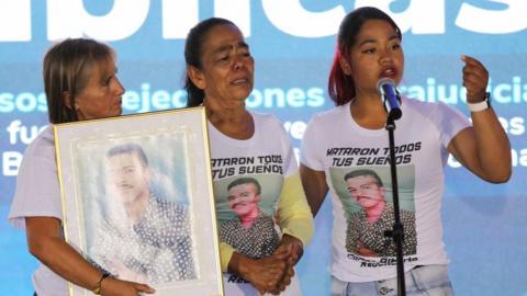 Relatives of victims of extrajudicial executions react during an act of public apology for extrajudicial executions in Bogota and Soacha perpetrated by the armed forces, in Bogota, Colombia October 3, 2023.