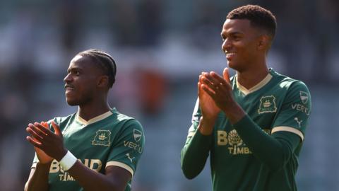 Bali Mumba and Morgan Whittaker applaud the Argyle fans