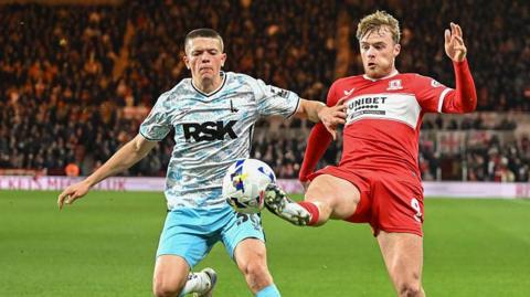 Keenan Gough (left) challenging for the ball while playing for Charlton