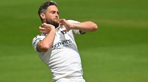 Chris Woakes playing for Warwickshire