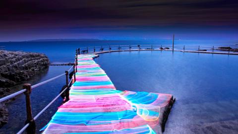 Rainbow Road - colourful pathway created on a jetty 