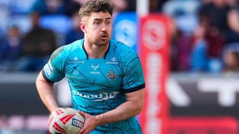 Adam Clune in action for Huddersfield Giants