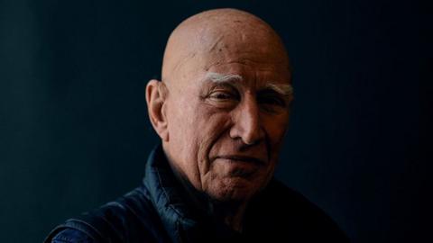 Brazilian photographer Sebastiao Salgado poses for a portrait at Somerset House, in London, on April 18, 2024.