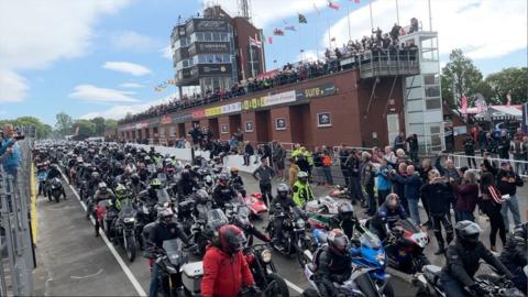 Motorbikes at the Grandstand at the start of the legacy lap