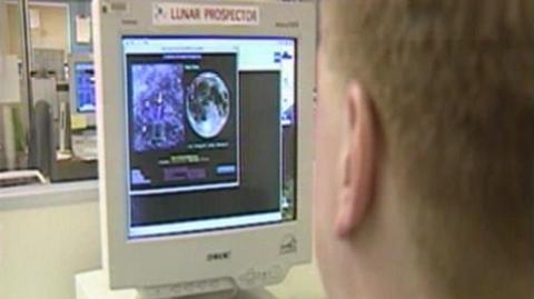 A computer monitor showing images of the moon.