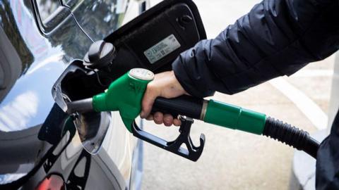 Fuel nozzle inserted into a vehicle tank at a service station illustrating fuel consumption and everyday energy use in Sartene South Corsica France on March 20, 2026