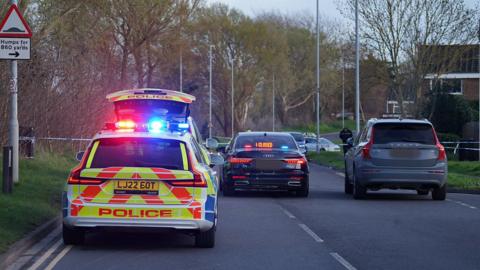 Closed road and emergency services at the scene