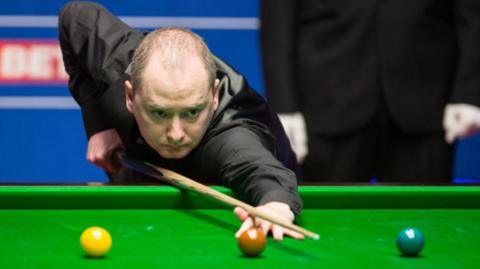 Graeme Dott watches a shot he has played at the Crucible Theatre, Sheffield, during the 2017 World Snooker Championship