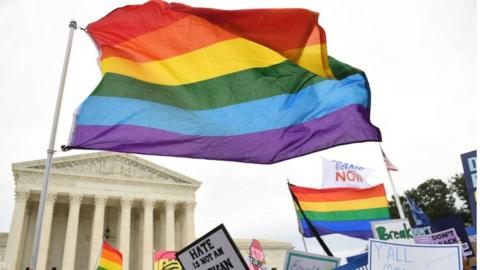 Demonstrators in favor of LGBT rights rally outside the US Supreme Court in Washington, DC, 8 October, 2019