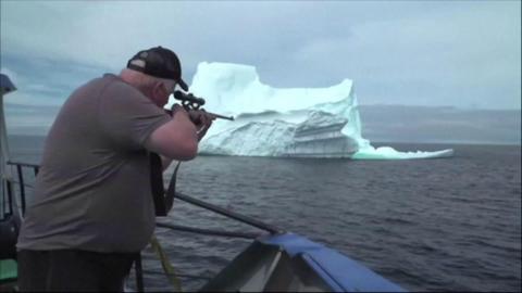 Man shooting iceberg