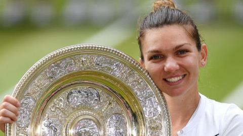 Simona Halep hugs the Venus Rosewater dish after winning the Wimbledon women's singles title in 2019