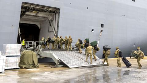 Australian Defence Force (ADF) personnel embarking onto HMAS Adelaide at the Port of Brisbane, Queensland, Australia, 20 January 2022 (issued 21 January 2022), before departure on Operation Tonga Assist 202 following the eruption of Tonga"s Hunga Tonga- Hunga Ha"apai underwater volcano on 15 January.