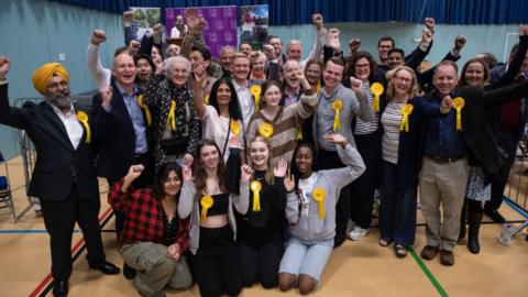 Winning Liberal Democrat candidates celebrate with family members and supporters at the local election count in the Royal Borough of Windsor and Maidenhead on 5 May 2023 in Maidenhead,