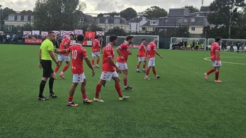 Jersey Bulls celebrate scoring against Worthing