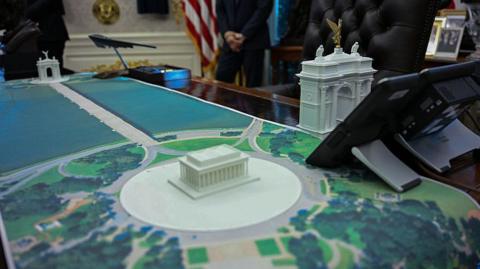 A plan for an arch across from the Lincoln Memorial is seen on the Resolute Desk as US President Donald Trump meets with Finnish President Alexander Stubb and Prime Minister Petteri Orpo in the Oval Office of the White House in Washington DC on 9 October 2025.