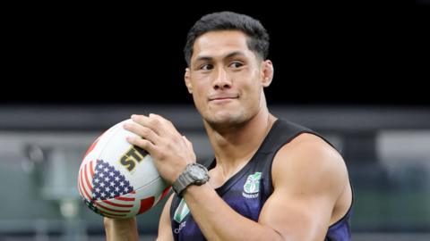 New Zealand Warriors' Roger Tuivasa-Sheck holds a rugby ball