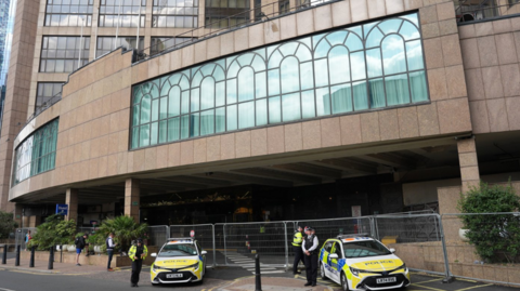 Police outside the Britannia International Hotel in Canary Wharf, London during an Abolish Asylum System demonstration. 
