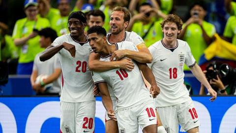 Jude Bellingham celebrates scoring England's third goal with Noni Madueke, Harry Kane and Anthony Gordon.