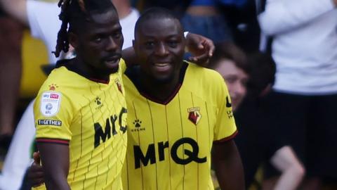 Edo Kayembe of Watford (right) celebrates scoring his team's third goal 