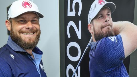 Tyrrell Hatton smiles alongside a picture of himself after winning the Dubai Desert Classic