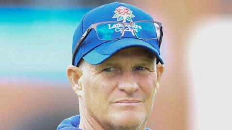 Dale Benkenstein, wearing a Lancashire training cap, watches practice 