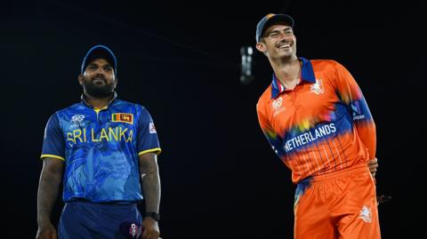 Wanindu Hasaranga of Sri Lanka and Scott Edwards of Netherlands interact before taking part in the coin toss prior to the ICC Men's T20 Cricket World Cup West Indies & USA 2024 match