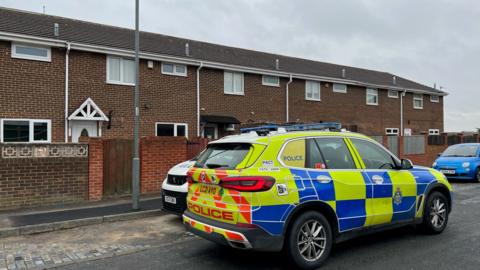 Police car outside row of houses in Shotton Colliery