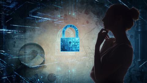 Dark silhouette of a person with a hand on their chin in front of an illustration of a blue padlock