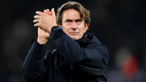 Head coach Thomas Frank applauds the Spurs fans after the Champions League defeat by Paris St-Germain.