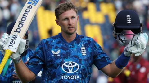 Joe Root raises his bat