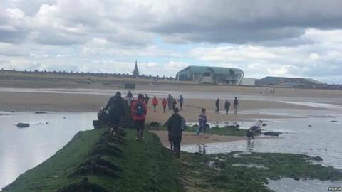 People walking towards the beach in Redcar