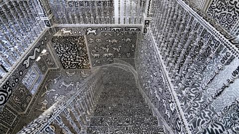 A view of the stairwell inside British artists' Sam Cox, aka Mr Doodle, as he reveals the Doodle House, a twelve-room mansion at Tenterden, in Kent, which has been covered, inside and out in the artist's trademark monochrome, cartoonish hand-drawn doodles.