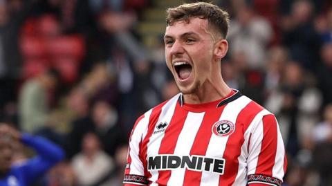 Harrison Burrows celebrates