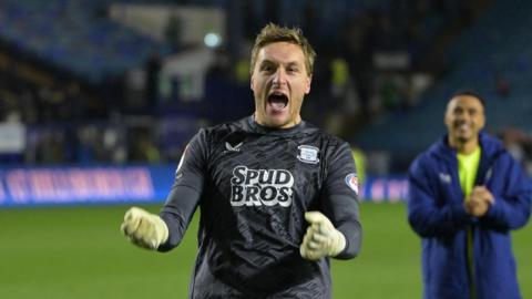 Preston keeper Daniel Iversen celebrates his side's win at Sheffield Wednesday after saving a penalty